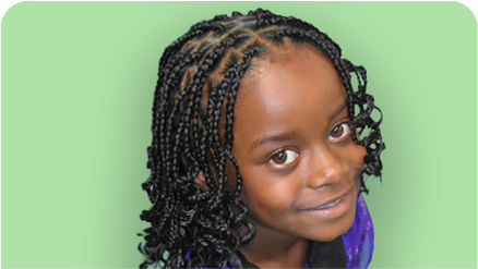 Braided young girl show casing long braids with curls